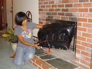 Memphis TN Home Inspection A Woman holding a fireplace plug