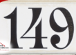 House number 149 displayed in black on a white background.