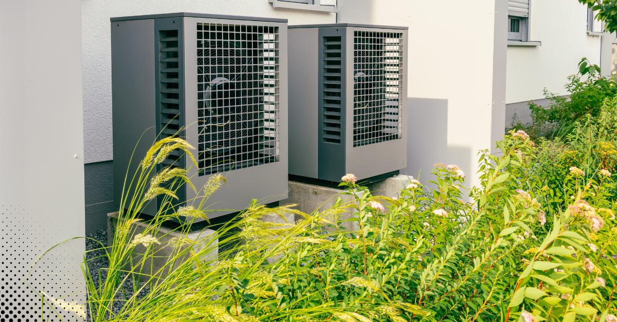 Outdoor HVAC units beside a residential building